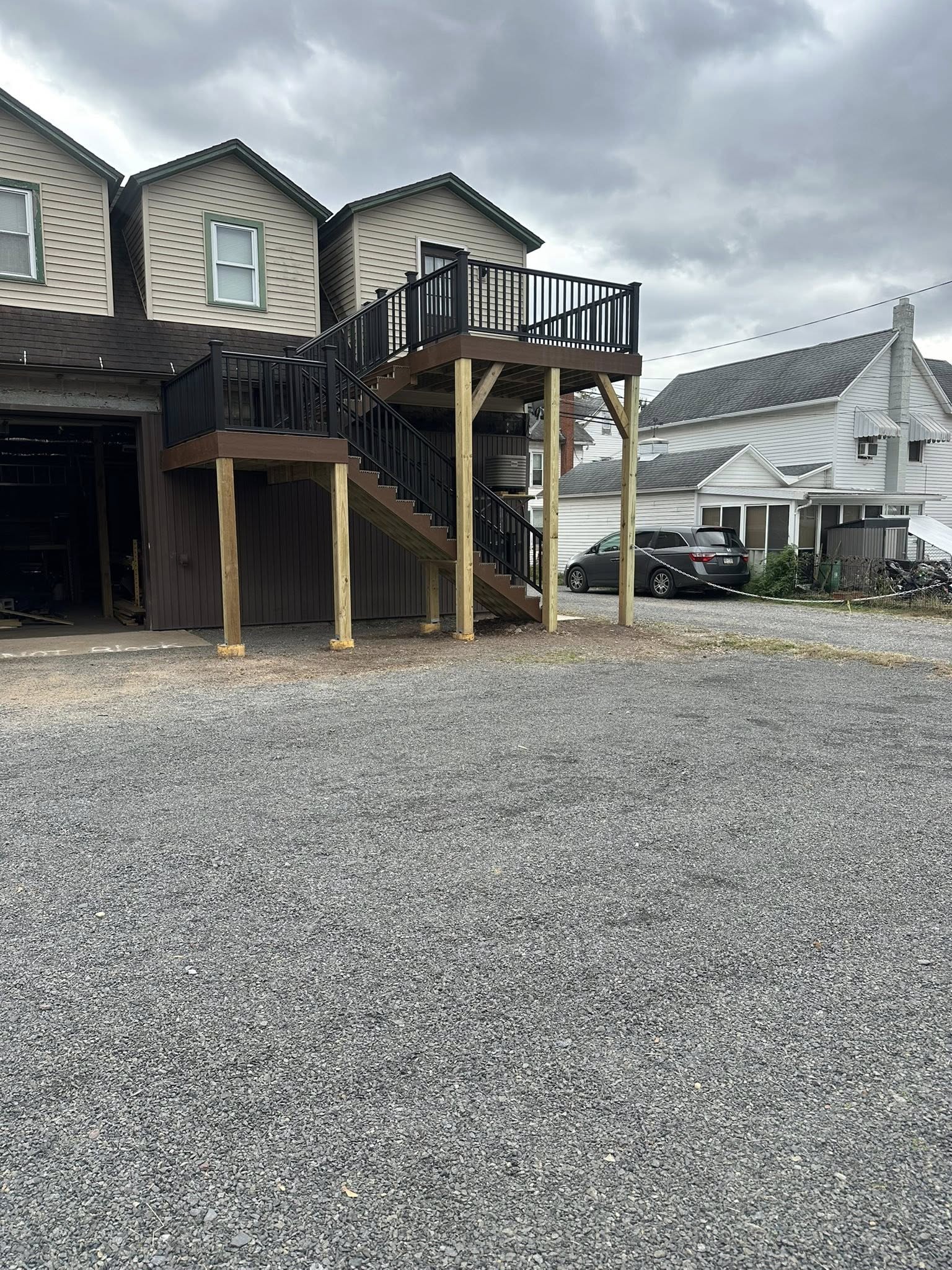 Multi-level composite deck installation in backyard.