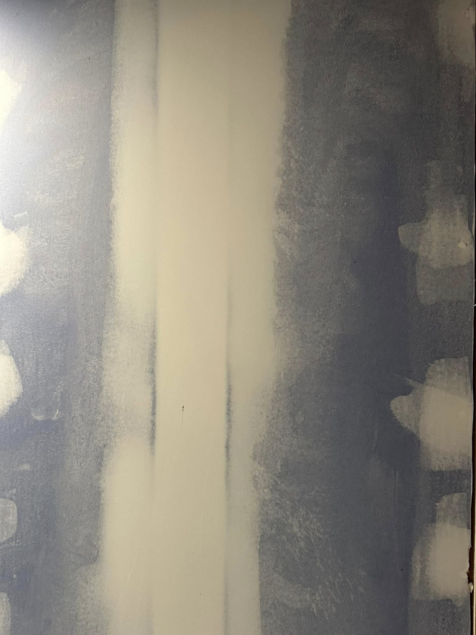 Interior painting project with crisp white walls and clean trim edges.