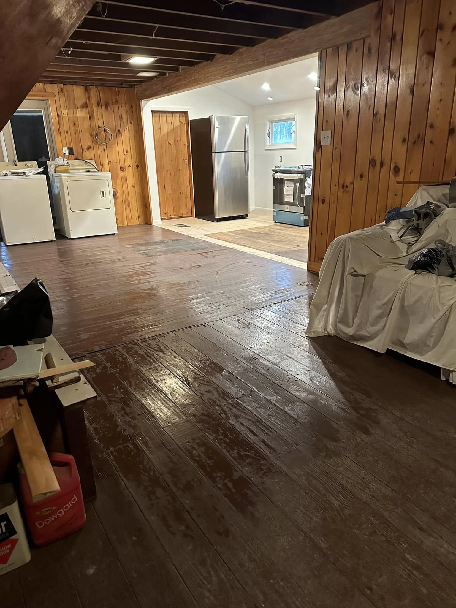 Finished home expansion with new living space and large windows.